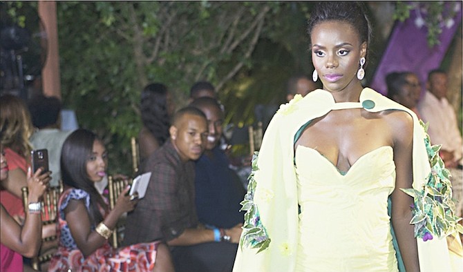 Miss Universe Grand Bahama Darronique Young struts for the audience during the Top Designer Award competition in a fitted gown designed by BTVI student Delano Marc. Photo: Miss Bahamas Organisation.
