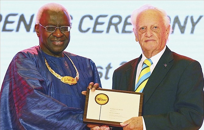 PARKER’S  IAAF PLAQUE of MERIT - Keith Parker, MBE, veteran Bahamian track and field coach and administrator, received an extraordinary honour from outgoing IAAF President Lamine Diack at the opening of the Beijing IAAF 50th Anniversary Congress on the eve of the Beijng World Championships for track and field. The award, the “ IAAF Plaque of Merit, awarded for meritorious service to world athletics,” was presented to coach Parker in recognition of his 50-plus years of service to world track and field, particularly in the North and Central Americas and Caribbean region (NACAC).
