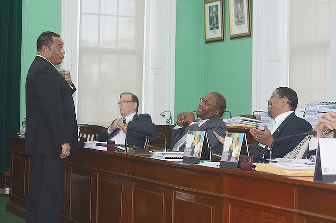 Prime Minister Perry Christie shares a lighter moment with members of the Opposition Edison Key, Neko Grant and Peter Turnquest in the House of Assembly. Photo: Peter Ramsay/BIS
