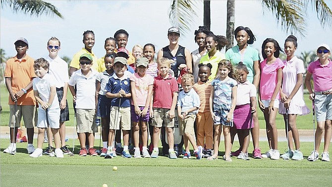 Scores of students and aspiring golfers participated in the LPGA Junior Clinic at the Ocean Club, Paradise Island, on Saturday.   
                                                                                                                                                                                                    Photo by Shawn Hanna/Tribune Staff