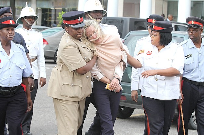 Donna Vasyli is led away from court after the verdict. Photo: Tim Clarke/Tribune staff