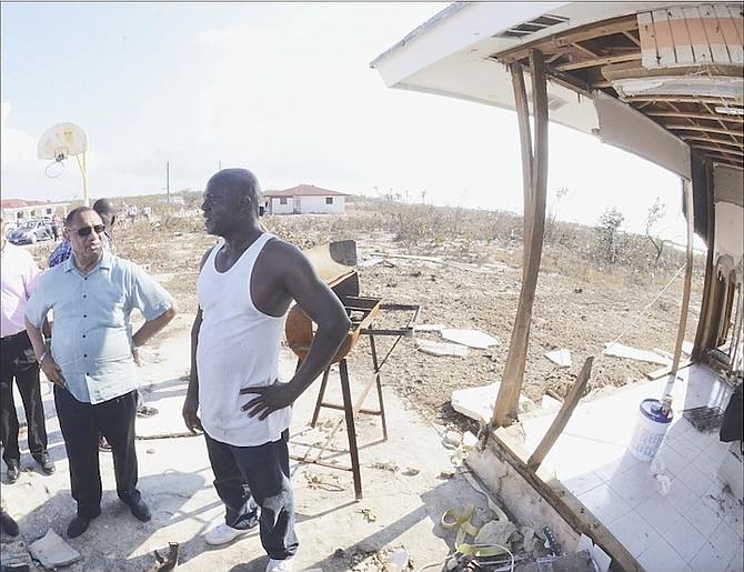 Prime Minister Perry Christie speaking to Acklins resident Lionel Rolle yesterday in the wake of Hurricane Joaquin.
Photo: Peter Ramsay/BIS 