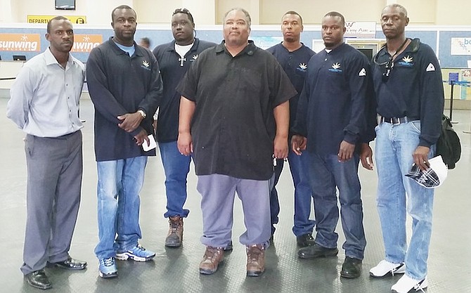 Grand Bahama Power Company linemen leave Grand Bahama airport on Sunday. Pictured (left to right) are Delano Arthur, Manager of Operations and Maintenance for Transmission & Distribution, Andre Spence, David Parker Jr., Troy Mackenzie, Director of Transmission & Distribution, Chad Bartlett, Arthur Spencer and Patrick Laing, the team leader. 
