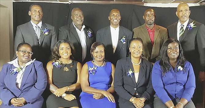 Presidential candidate Rosamunde Carey (centre front row) poses above with her slate of officers. Seated from left are Sharon Gardiner, Tonique Williams, Carey, Mildred Adderley and Mabeline Miller. Standing from left are Carl Oliver, Rupert Gardiner, Dexter Bodie, Troy McIntosh and Philip Carey. Missing is Sandra Laing from Grand Bahama.
