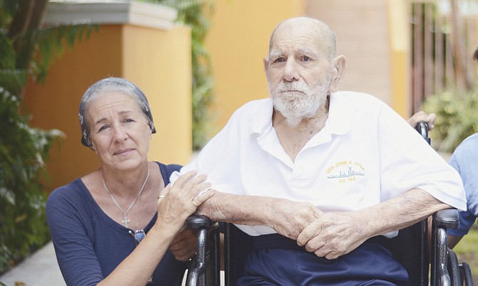 Fiona Maillis with her father-in-law Anthony Maillis, a Second World War veteran, whose care needs after being displaced in the wake of Hurricane Joaquin leave the family feeling trapped in New Providence. Photo: Shawn Hanna/Tribune Staff