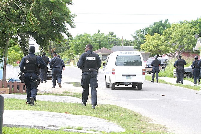 Police at the scene in Nassau Village.