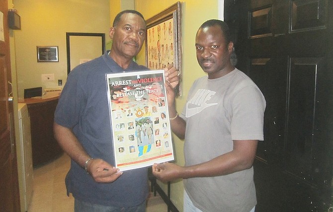 Activist Paul Joseph on Monday visited Media House, where the offices of KISS 96FM, 100JAMZ, and The Tribune are located, and presented Office Manager Glen Forbes with his new poster, Arrest the Violence and Release the Peace. 
Photo: Denise Maycock/Tribune Staff 
