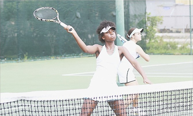 IESHA SHEPHERD in doubles action during the ITF Goombay Splash Bowl at the National Tennis Centre.  
Photo by Tim Clarke/Tribune Staff