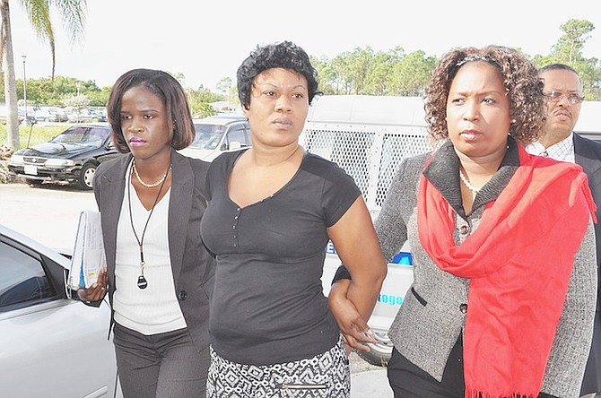 Rosa Adaline Dorestil, aka Rolanda Dorestil, being led into court yesterday. 
Photo: Vandyke Hepburn