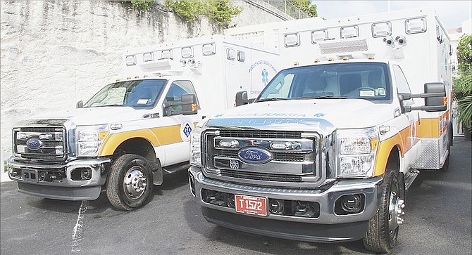 The two new ambulances handed over to the Public Hospitals Authority yesterday. 
Photos: Tim Clarke/Tribune Staff