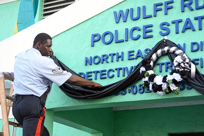 A tribute to police officer Wesley Nicholas Gaitor at Wulff Road Police Station.