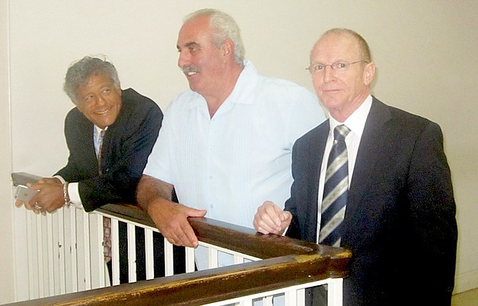 Bruno Rufa flanked by his lawyers Fred Smith QC (left) and Carey Leonard, of Callenders and Co, at an earlier hearing. Photo: Denise Maycock/Tribune Staff
