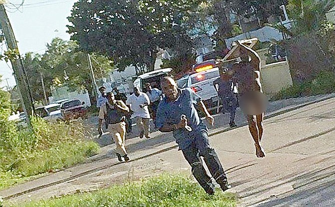 A picture circulating on social media reportedly showing police during a chase with a naked man.