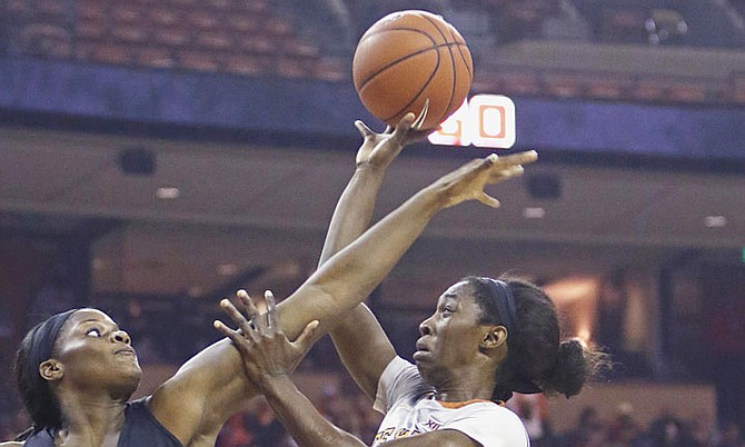 
Texas guard Lashann Higgs, front right, shoots against Baylor forward Kalani Brown during an NCAA college basketball game on Sunday in Austin, Texas. (AP)