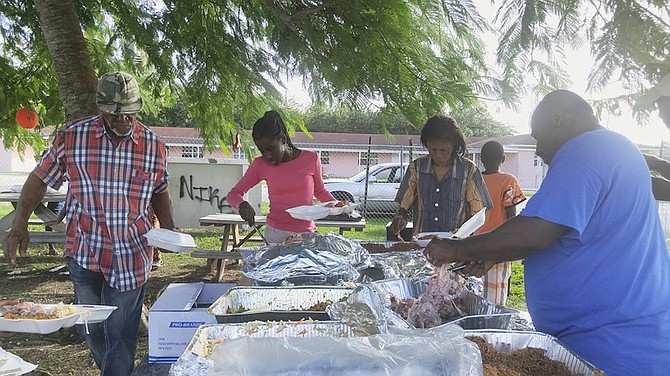 Some of those attending as more than 1,000 people in three communities received Christmas lunch in Grand Bahama thanks to the work of charity teams. 