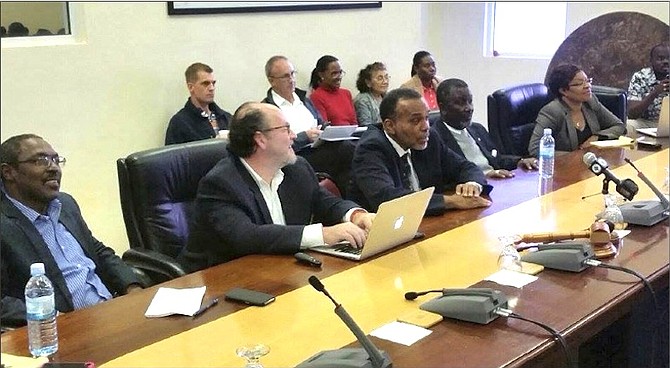 From left, NHI chief at Secretariat Peter Deveaux Isaacs, a Sanigest consultant, chief medical officer Dr Glen Beneby, and Parliamentary Secretary in the Ministry of Health Marco Rolle. 