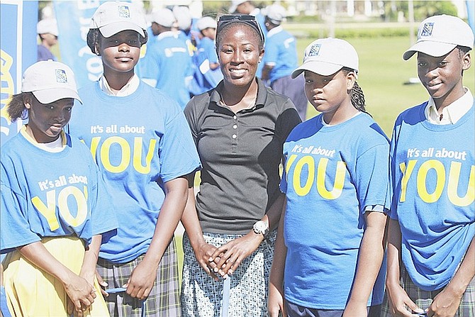 BAHAMIAN pro golfer Georgette Rolle (centre) can be seen with students during yesterday’s LPGA Junior Clinic as part of the fourth annual Pure Silk Bahamas LPGA Golf Classic at the Ocean Club Golf Course on Paradise Island.
Photo by Tim Clarke/Tribune Staff