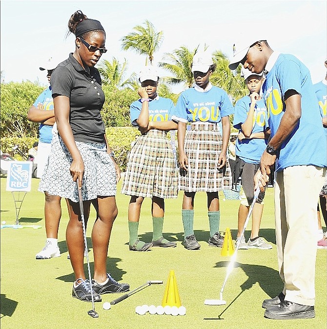 Bahamian woman golfer Georgette Rolle, Pure Silk-Bahamas LPGA Classic participant coaches students in basic techniques at the Pure Silk-Bahamas LPGA Classic Jr Golf Clinic at the Ocean Club Golf Course on Tuesday, January 26, 2016.  Photos: Kemuel Stubbs/BIS