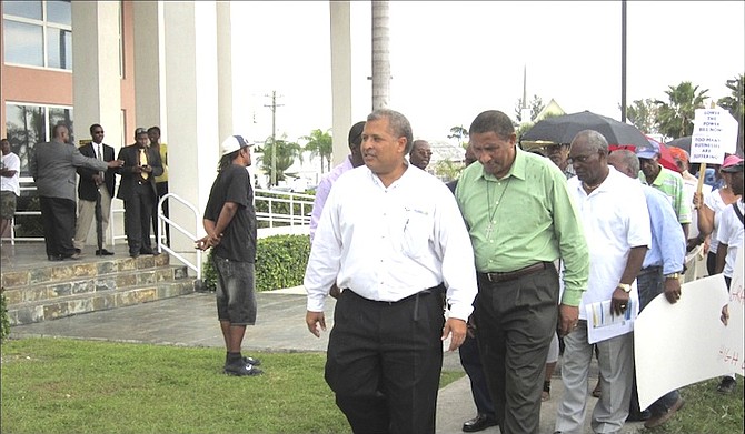 Pastor Eddie Victor, convener of Coalition for Concerned Citizens, is seen leading a previous protest march around the GB Power Company offices in Grand Bahama. 