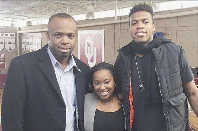 Bahamas Consul General to Atlanta Randy Rolle (left) and Vice Consul Mia Ferguson are pictured with Bahamian basketball sensation Buddy Hield after he scored 30 points to lead the No. 1-ranked Oklahoma Sooners to a 91-67 rout of Texas Tech on Tuesday night. 