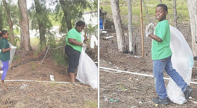 RECLAIM OUR TERRITORY: Young people from Ebenezer Baptist Church in Exuma volunteer their time to help in a clean-up campaign.
