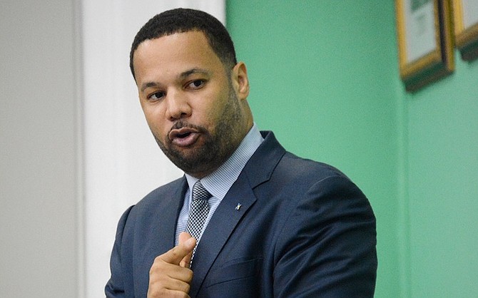 Andre Rollins speaks in the House of Assembly.