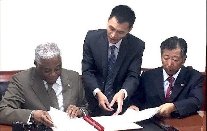 Dr Bernard Nottage accepts the donation of $1.2m from China to pay for military equipment. 