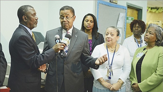 Dr Perry Gomez, Minister of Health, speaks at the presentation of three new dialysis machines to the dialysis unit and a new mammography workstation to the radiology department at the Princess Margaret Hospital. 
Photos: Shawn Hanna/Tribune Staff