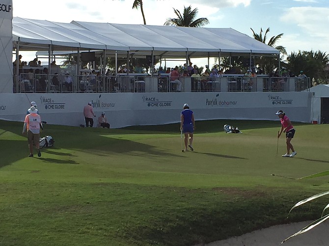 Ilhee Lee (right) lines up a putt on the 18th hole on Saturday to stay in contention for victory in the Pure Silk-Bahamas LPGA Classic