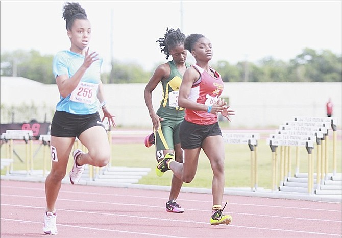 Athletes compete in the 13th annual Club Monica Athletics Track and Field Classic at the Thomas A Robinson Track and Field Stadium on Saturday. There were some athletes who made the qualifying standards for the CARIFTA Games to be held in Grenada over the Easter holiday weekend.
Photo by Tim Clarke/Tribune Staff