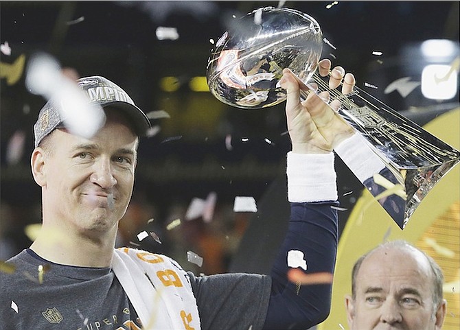 Denver Broncos’ Peyton Manning (18) holds up the trophy after NFL Super Bowl 50 in Santa Clara, California. The Broncos beat the Panthers 24-10. (AP)