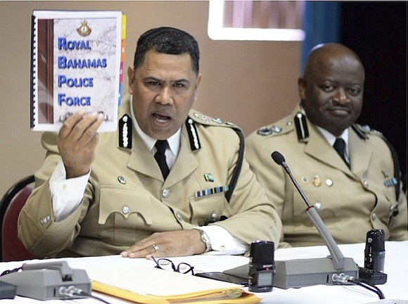 Ellison Greenslade, commissioner of police, with the report on last year’s crime statistics. 
Photo: Shawn Hanna/Tribune staff