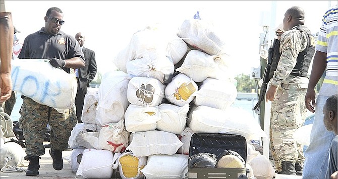 Seized drugs being offloaded at East Bay Street after an interception last July.
Photo: Tim Clarke/Tribune Staff