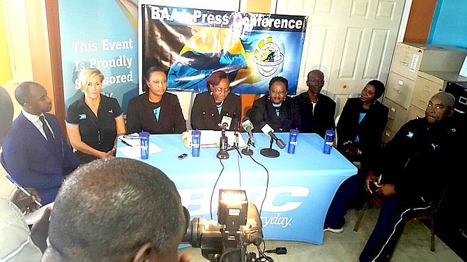 BAAA president Rosamude Carey, flanked by her executives, coaches and BTC sponsor, reveal plans for the 2016 BAAA track and field season during a press conference yesterday in the BAAA office at Thomas A Robinson Track and Field Stadium.
                                                                                                                                                                              Photo by Philip Gray
