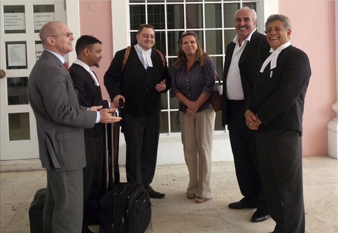 Bruno Rufa, second from right, and his lawyer Fred Smith, far right, outside court.