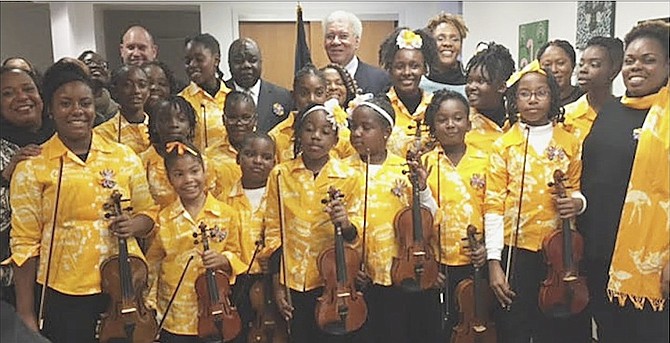 STRING City Violinists with Dr Elliston Rahming (back row, centre-left) and Forrester Carroll, Bahamas Consul General to New York (back row, centre-right), in New York.