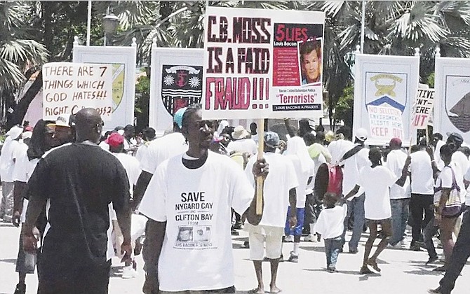 One of the pictures posted to Facebook of the Nygard support march in July 2013 showing a protestor holding a sign making accusations against CB Moss.