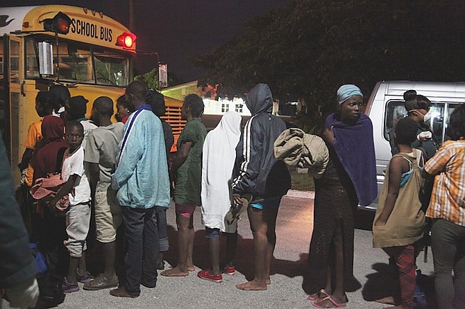 Migrants disembarking HMBS P44 and being turned over to Immigration officials. 
Photo: Shari Colebrooke
