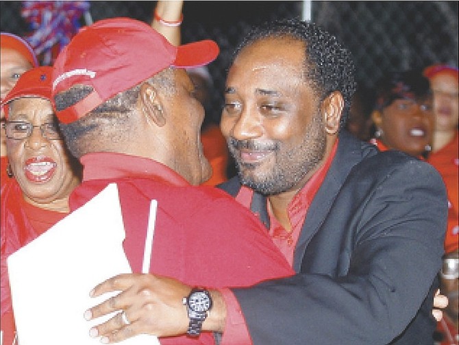 Cassius Stuart embraces former Prime Minister Hubert Ingraham in 2012 after being wooed to run as the FNM’s candidate in Bamboo Town. 
Photo: Tim Clarke