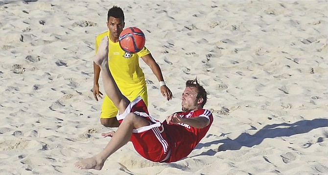 CAMERON HEPPLE, of the Bahamas, in action against Switzerland during the Kalik Light Cup International Friendly at the Bahamas Football Association’s beach soccer facilities on East Bay Street over the weekend.
Photo courtesy of bahamaslocal.com