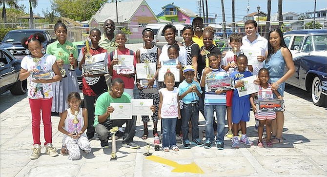 The winners and their prizes at the Antique Auto Club of the Bahamas annual children’s art contest.
