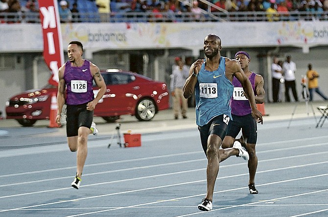 LASHAWN MERRITT, of the US, wins the 200 metres in the 2nd Chris Brown Bahamas Invitational on Saturday. Also shown are Wallace Spearmon (far left), of the US, and Mike Rodgers, of the US.  