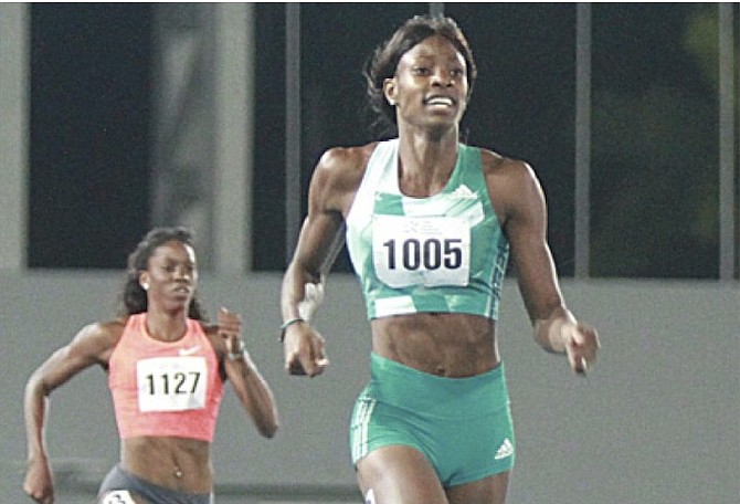 GREAT STRIDES: Shaunae Miller wins the 400 metres on Saturday in the 2nd Chris Brown Bahamas Invitational at the Thomas A Robinson National Stadium. Also shown is Ashley Spencer of the US.
Photo by Tim Clarke/Tribune Staff