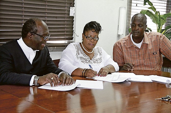 TUC President Obie Ferguson, left, with Jennifer Brown and Huden Cox, of the Bahamas industries Manufacturing Allied Workers Union Huden Cox. Photo: Tim Clarke/Tribune Staff