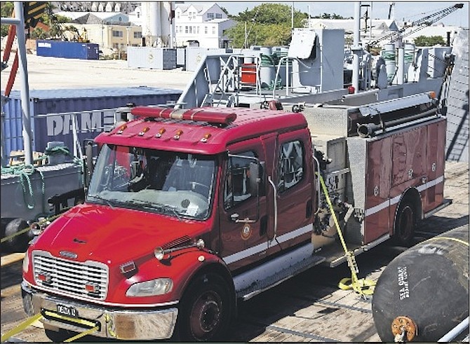 A fire truck being transported to help in Crooked Island. 