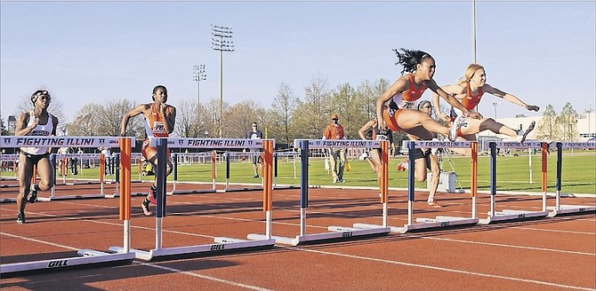 GETTING OVER THE HURDLE: Pedrya Seymour leads the pack in the women’s 100m hurdles at the Illinois Twilight meet in Champaign, Illinois.