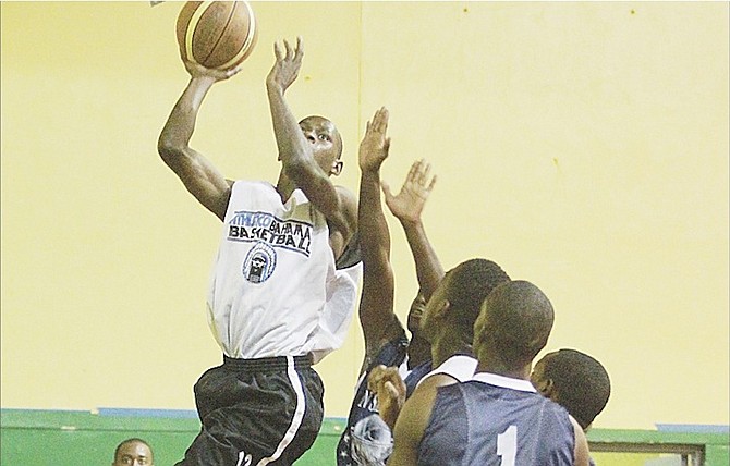 HANGTIME: Athletico Bahamas routed San Salvador 72-54 and the Police Enforcers handcuffed the Bimini Marlins 75-56 last night as the Bahamas Basketball Federation’s Annual Bunny Levarity National Basketball Tournament jumped off at the DW Davis Gymnasium.
Photo by Tim Clarke/Tribune Staff 