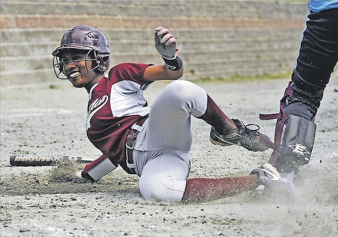 WINNING SLIDE: Kendalia Turner, of the Bahamas, slides home for the winning run during the Vikings’ 12-11 win over North Country on April 23. The talented shortstop has secured an athletic scholarship to attend Georgian Court University in New Jersey.
                                                                                                                                                                                                             Photo by Michael Beniash