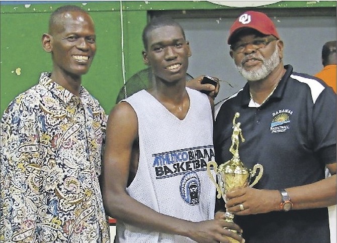 MOST VALUABLE PLAYER: Dylan Musgrove (centre) was the most valuable player in the B Division of Bahamas Basketball Federation’s Annual BTC Bunny Levarity National Championships. Also shown is Dylan’s father, Gordon 'Slanks' Musgrove, and BBF President Charlie 'Softly' Robins. 
