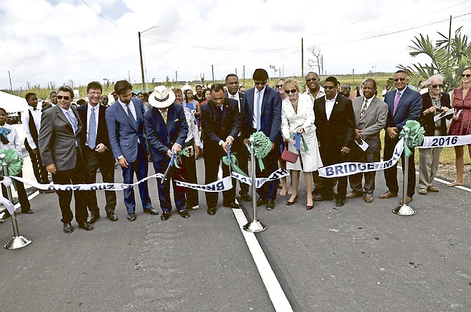 Prime Minister Perry Christie, centre, cuts the ribbon to open the Sir Jack Hayward Bridge. 
Photo: Vandyke Hepburn